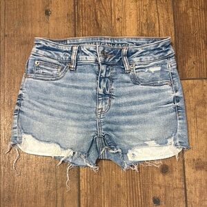 american eagle “next level stretch”medium wash distressed denim jean shorts